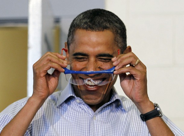 U.S. President Barack Obama dons protective glasses at Bluestone High School in Skipwith